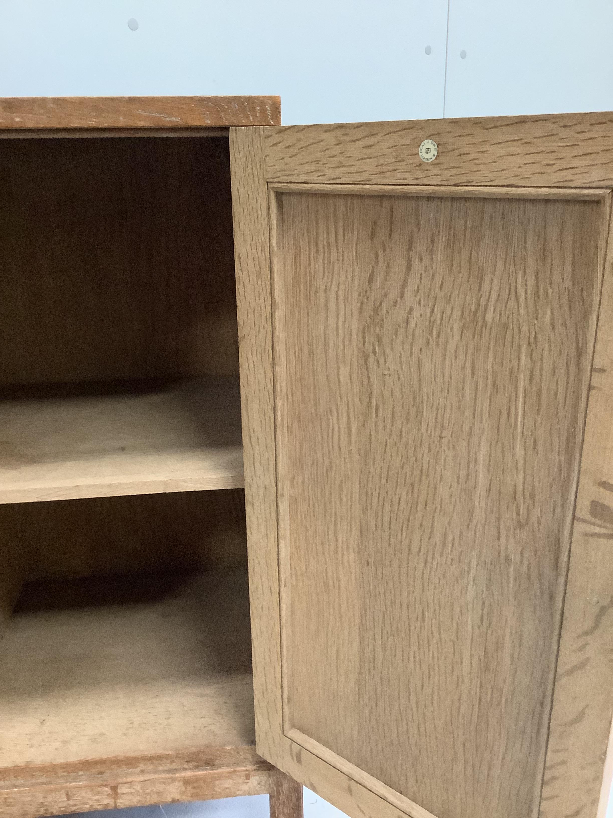 Heal & Son Ltd. London, a bleached oak bedside cabinet, width 36cm, depth 35cm, height 76cm, together with a pair of similar wall cabinets